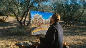 Vincent painting in an orchard. Photo courtesy of CBS films